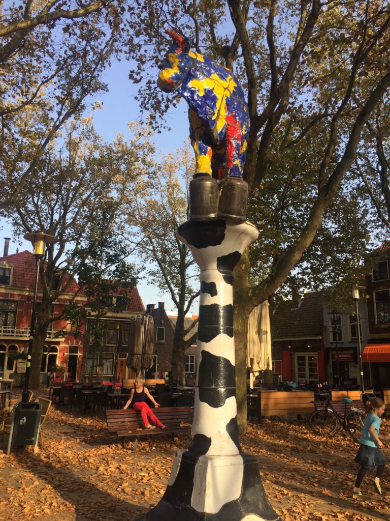 A post painted like a cow in Delft